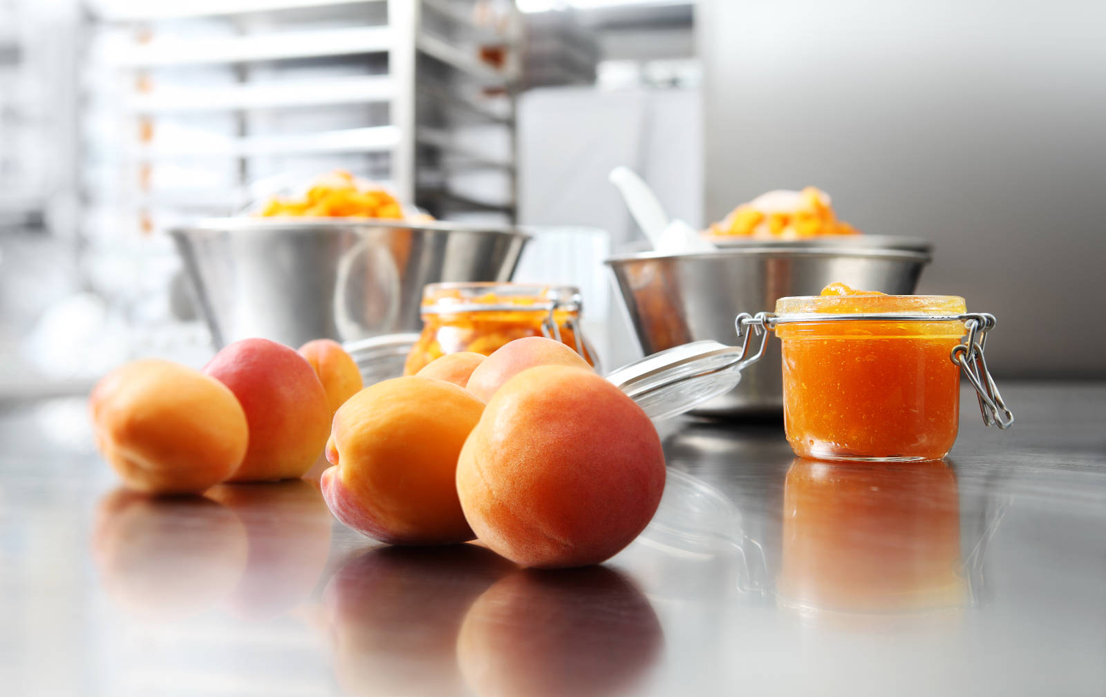 Jam,from,apricots,in,a,glass,jar,on,a,polished